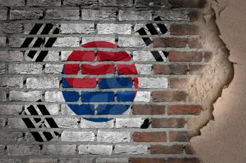 Dark brick wall texture with plaster - flag painted on wall - South Korea