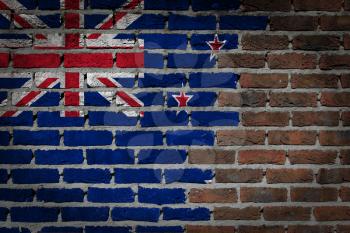 Very old dark red brick wall texture with flag - New Zealand