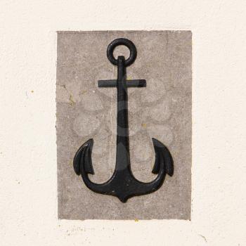 Stone anchor on wall background, black, grey and white