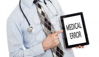Doctor, isolated on white backgroun,  holding digital tablet - Medical error