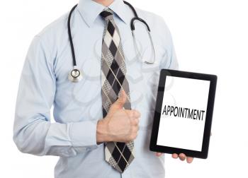 Doctor, isolated on white backgroun,  holding digital tablet - Appointment
