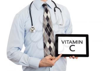 Doctor, isolated on white backgroun,  holding digital tablet - Vitamin C