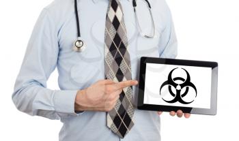 Doctor holding tablet, isolated on white - Warning! Biohazard!