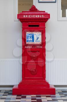 Retro dutch red mail box in a post offfice