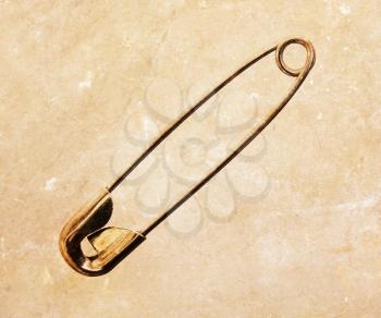 Regular safety pin on an isolated background
