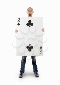 Businessman with large playing card - Two of clubs