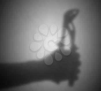 Silhouette behind a transparent paper - Blurred - Pipe wrench