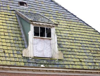 Broken roof of an abandoned farm in the Netherlands