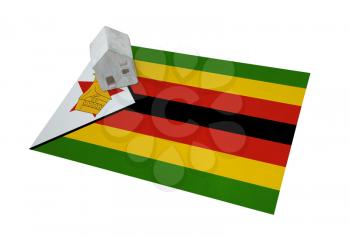 Small house on a flag - Living or migrating to Zimbabwe