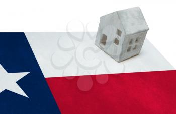 Small house on a flag - Living or migrating to Texas