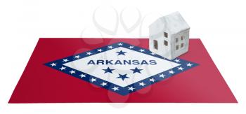 Small house on a flag - Living or migrating to Arkansas