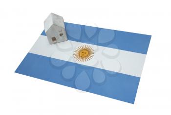 Small house on a flag - Living or migrating to Argentina