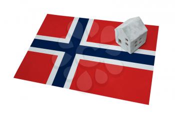 Small house on a flag - Living or migrating to Norway