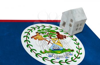 Small house on a flag - Living or migrating to Belize