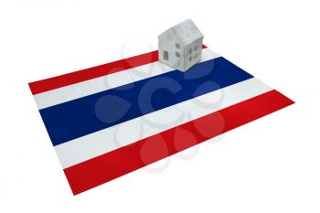 Small house on a flag - Living or migrating to Thailand