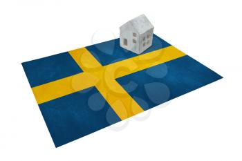 Small house on a flag - Living or migrating to Sweden