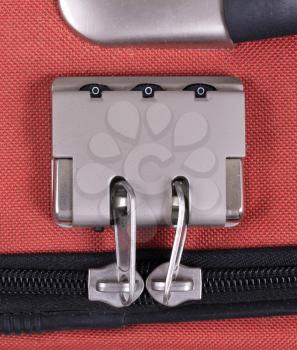 Combination lock on suitcase travel bag. Number, steel - Red bag