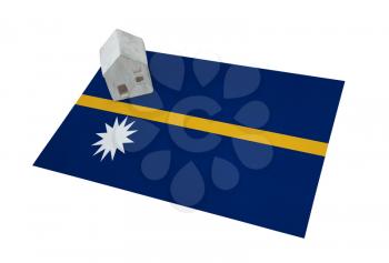 Small house on a flag - Living or migrating to Nauru