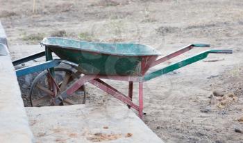 Old dirty metal wheelbarrow at a construction site on Madagascar