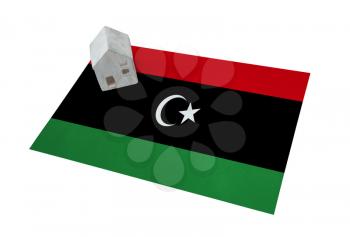 Small house on a flag - Living or migrating to Libya