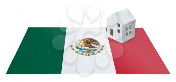 Small house on a flag - Living or migrating to Mexico