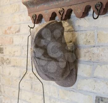 Old farmers hat hanging on a hanger - The Netherlands