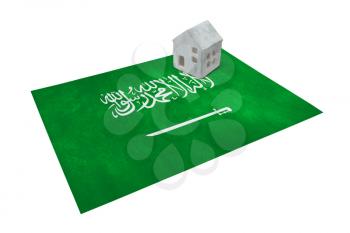 Small house on a flag - Living or migrating to Saudi Arabia