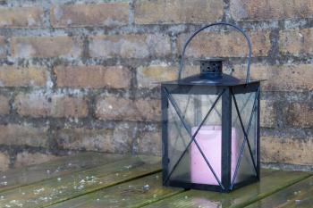 Wet lamp for candles in a garden