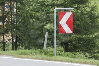 Sign at a corner on a road in the Austrian Alps