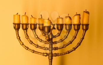 Jewish holiday Hanukkah and its famous nine-branched menorah - Vintage setting