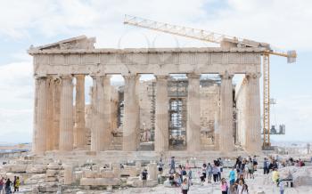 Acropolis, Athens, Greece - October 24, 2017: Many tourists from different nations visit the Parthenon temple on the Acropolis hill.