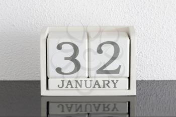 White block calendar present date 32 and month January on white wall background - Extra day