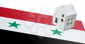 Small house on a flag - Living or migrating to Syria