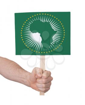 Hand holding small card, isolated on white - Flag of African Union