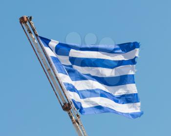 Greek flag waving under clear sky - Athens