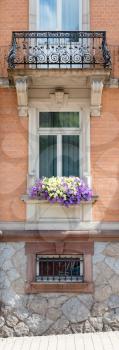 Old window and flowers at an old building, Austria