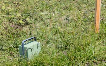 Green battery powering an electric fence - Austria