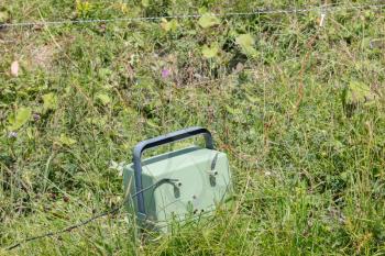 Green battery powering an electric fence - Austria