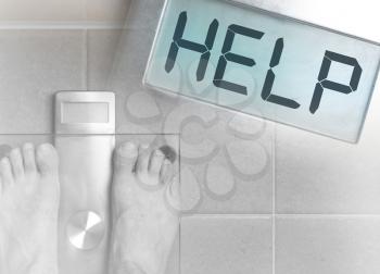 Closeup of man's feet on weight scale - Help