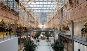 Berlin, Germany - December 30, 2019: Potsdamer Platz Arkaden Shopping Mall in Christmas Decoration, Garlands and Lights