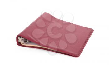 Old red ring binder isolated on a white background
