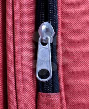 Suitcase zipper, selective focus - Old red bag