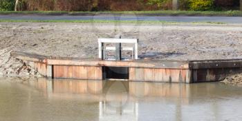Water management in the Netherlands - Small barrier in a pond