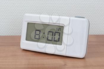 Clock radio on a desk - Time - 08.00 AM