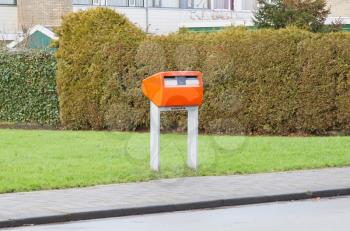 Posting a letter in the Netherlands - Orange letterbox