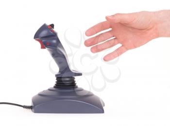 Hand holding gaming joystick, isolated on a white background