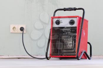 Compact red heater, drying the floor before installing the PVC floor