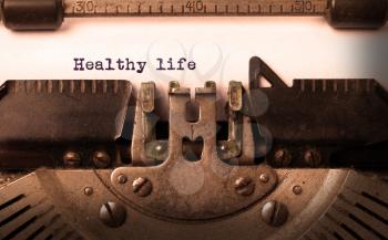 Vintage inscription made by old typewriter, healthy life
