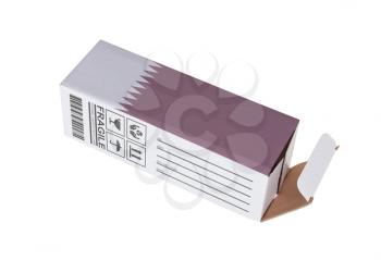 Concept of export, opened paper box - Product of Qatar