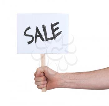 Hand holding sign, isolated on white - Sale